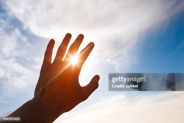 renewable energy of the sun - back lit hand stock pictures, royalty-free photos & images