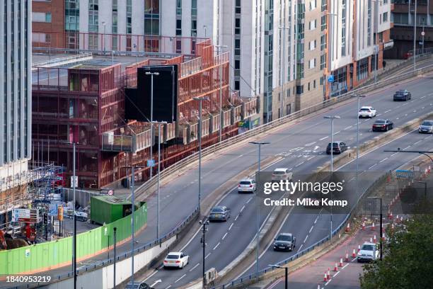 Cars in the 30mph Clean Air Zone run by Birmingham City Council along the A38 Bristol Street in the city centre which cuts through new high rise...