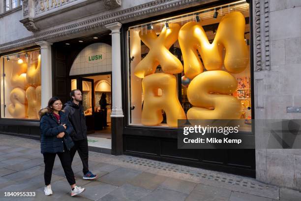 Inflatable letters spelling the word Xmas as a Christmas shop window display for the cosmetic brand Lush on 13th November 2023 in London, United...