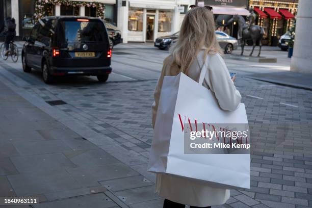 Woman carrying a Valentino bag on Bond Street on 15th November 2023 in London, United Kingdom. Bond Street is one of the principal streets in the...