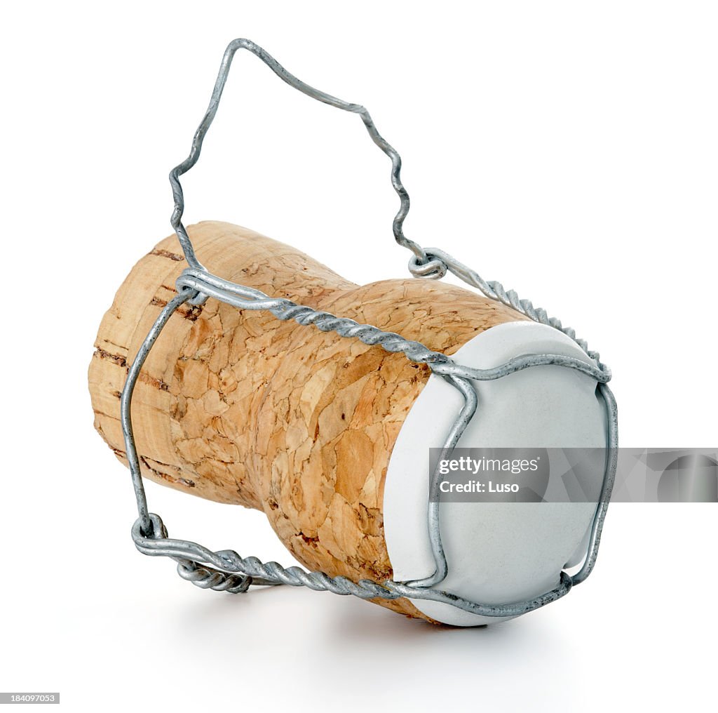 A single champagne cork isolated on a white background