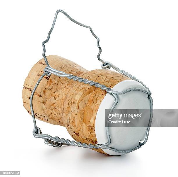 a single champagne cork isolated on a white background - champagne cork stock pictures, royalty-free photos & images