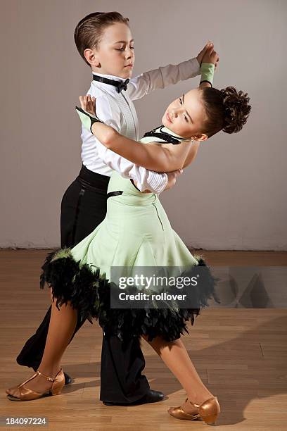 two young children dancing the waltz - kids ballroom dancing stock pictures, royalty-free photos & images