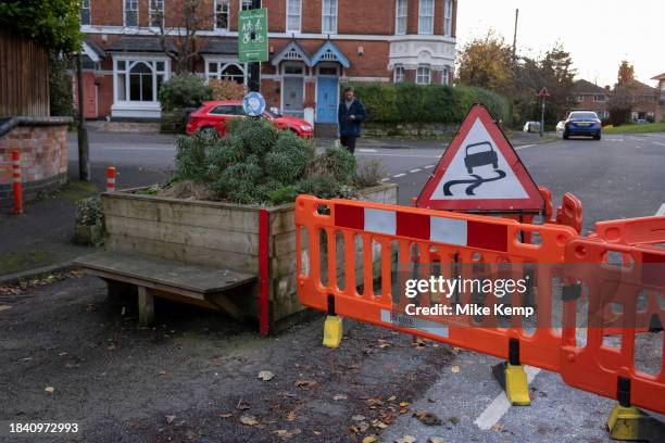 Flattened low-traffic neighbourhood bollard in Moseley following a driver intentionally attempting to drive through it and now surrounded by red...