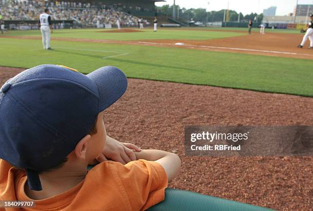 little boy at baseball game dreams concept - baseball game stadium stockfoto's en -beelden