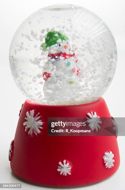 schneemann in snow globe - snow globe stock-fotos und bilder