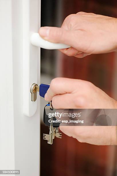 locking or unlocking a modern glazed door - door lock stock pictures, royalty-free photos & images