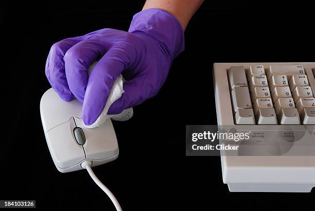 cleaning up the computer - purple glove stock pictures, royalty-free photos & images