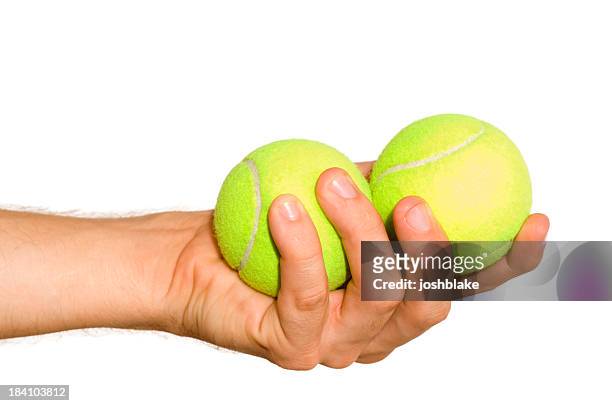 balls - holding two things stock pictures, royalty-free photos & images