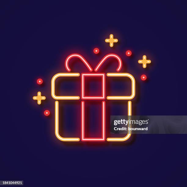 gift neon icon - uv light stock illustrations