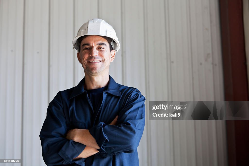 Hispanic worker wearing hard hat