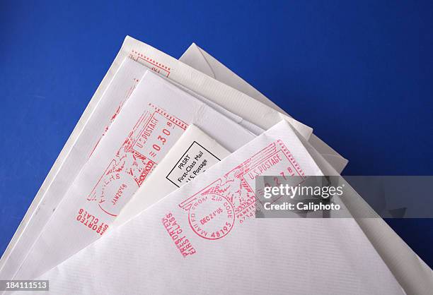 business letters on blue background - envelope stock pictures, royalty-free photos & images