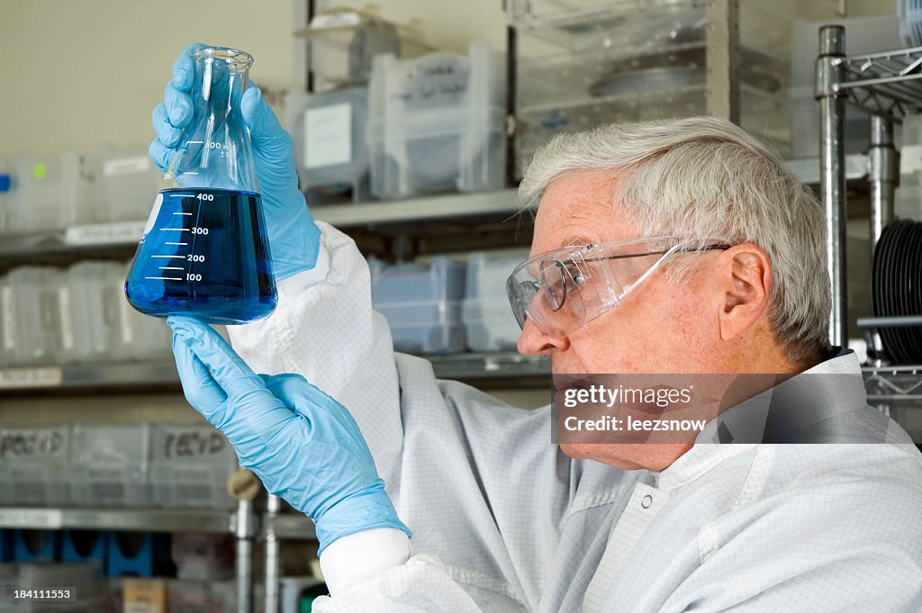 Senior Chemist Analyzing Blue Liquid