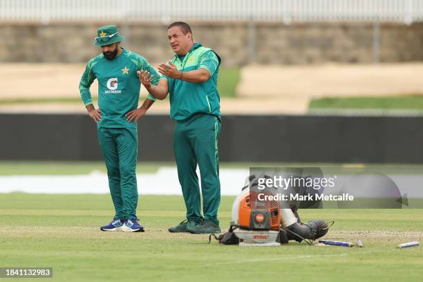 Pakistan batting coach Adam Hollioake inspects the wicke during a delay to the start of play due to an overnight storm during day four of the Tour...