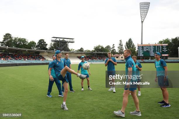 The Prime Ministers XI play football during a delay to the start of play due to an overnight storm during day four of the Tour match between PMs XI...