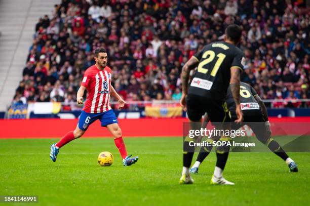 Jorge Resurreccion Merodio of Atletico Madrid seen in action with the ball against Juan Brandariz Movilla and Dion Lopy of Almeria during the La Liga...