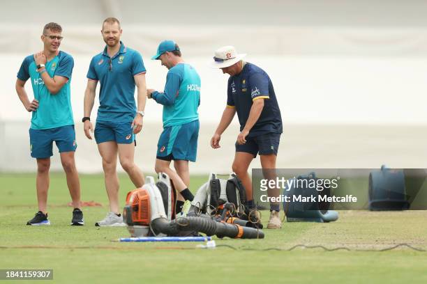 Groundstaff attend to blowers attempting to dry the wicket during a delay to the start of play due to an overnight storm during day four of the Tour...