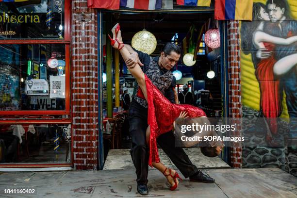 Tango dancers are seen dancing in La Boca.