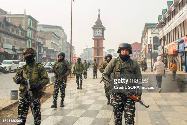 Indian paramilitary personnel patrol along a road in Srinagar ahead of Supreme Court's verdict on Article 370. India's top court on Monday upheld the...