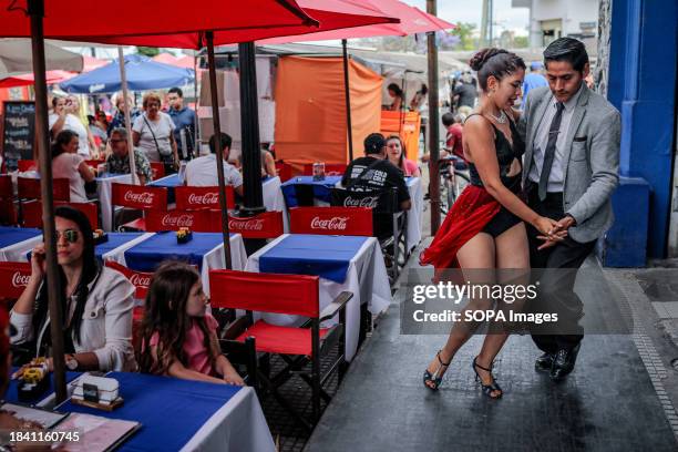 Tango dancers are seen dancing in La Boca.