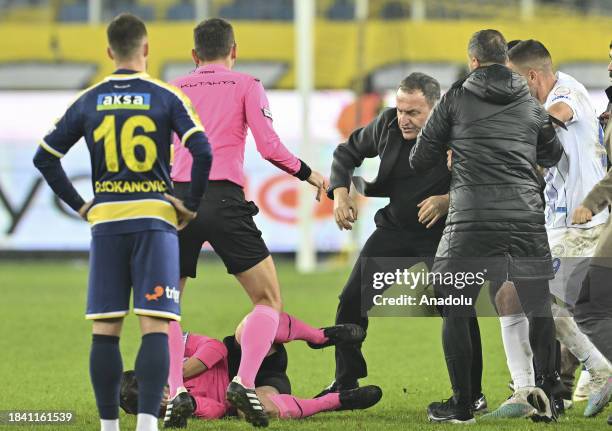 Referee Halil Umut Meler falls to the ground after Faruk Koca, President of MKE Ankaragucu throws a punch to him after the Turkish Super Lig week 15...