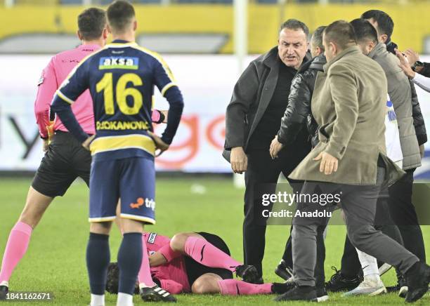 Referee Halil Umut Meler falls to the ground after Faruk Koca, President of MKE Ankaragucu throws a punch to him after the Turkish Super Lig week 15...