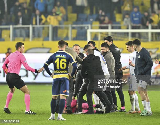 Referee Halil Umut Meler falls to the ground after Faruk Koca, President of MKE Ankaragucu throws a punch to him after the Turkish Super Lig week 15...