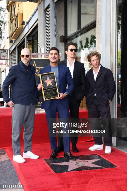 Actor Zac Efron poses with Sean Durkin , Miles Teller and Jeremy Allen White during his Hollywood Walk of Fame ceremony in Hollywood, California,...