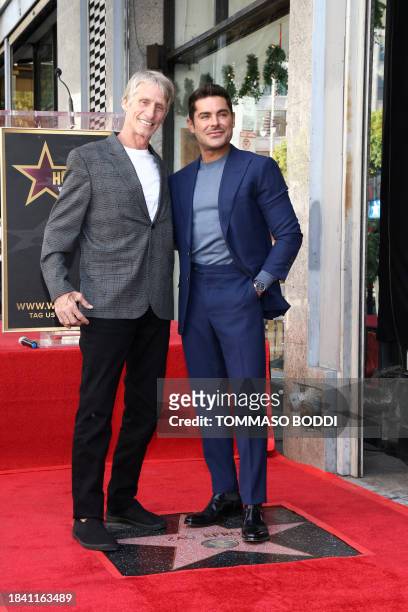 Actor Zac Efron poses with Kevin Von Erich during his Hollywood Walk of Fame ceremony in Hollywood, California, December 11, 2023.
