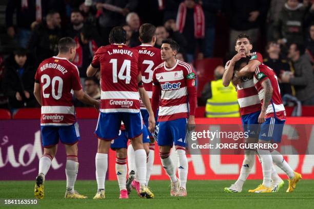 Granada's players celebrate a goal during the Spanish league football match Granada FC against Athletic Club Bilbao at Los Carmenes stadium in...