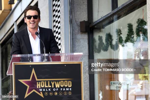 Miles Teller speaks during the ceremony honoring Zac Efron with a Star on the Hollywood Walk of Fame on December 11, 2023 in Hollywood, California.