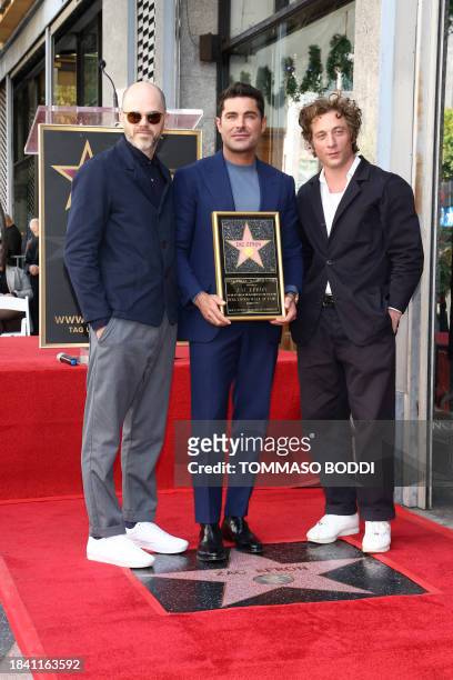 Actor Zac Efron poses with Sean Durkin and Jeremy Allen White during his Hollywood Walk of Fame ceremony in Hollywood, California, December 11, 2023.