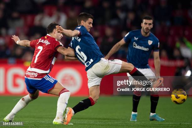 Granada's Argentinian forward Lucas Boye vies with Athletic Bilbao's Spanish midfielder Inigo Ruiz de Galarreta during the Spanish league football...