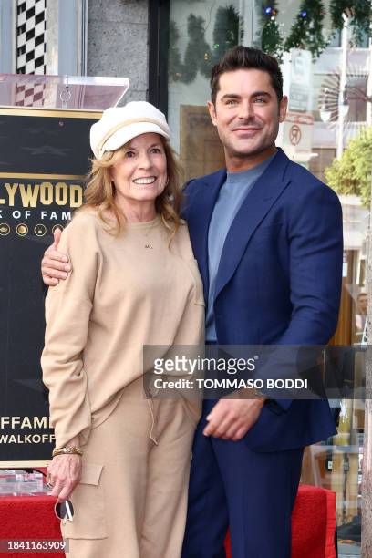 Actor Zac Efron poses with Starla Baskett during his Hollywood Walk of Fame ceremony in Hollywood, California, December 11, 2023.