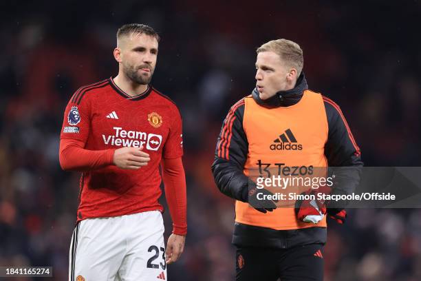 Luke Shaw of Manchester United and Donny van de Beek of Manchester United walk off together after the Premier League match between Manchester United...
