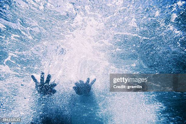 underwater shot of a woman in the sea - drowning stock pictures, royalty-free photos & images