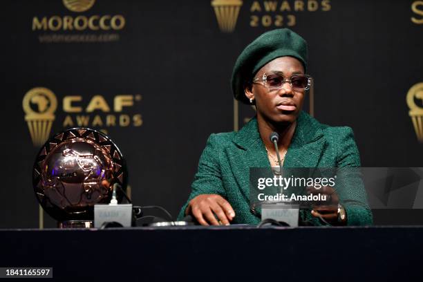 Player of the Year, Asisat Oshoala makes a speech at the Confederation of African Football Awards 2023 in the Moroccan city of Marrakech on December...