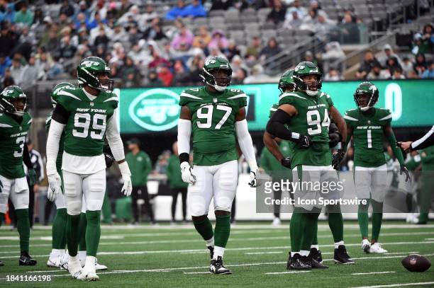 New York Jets defenders Will McDonald IV , Jalyn Holmes and Solomon Thomas get ready for a play during game featuring the Houston Texans and the New...