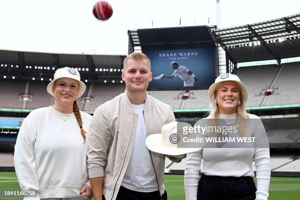 Summer, Jackson, and Brooke Warne - children of former Australian cricket great Shane Warne who died of a heart attack in 2022 - pose for photos at...