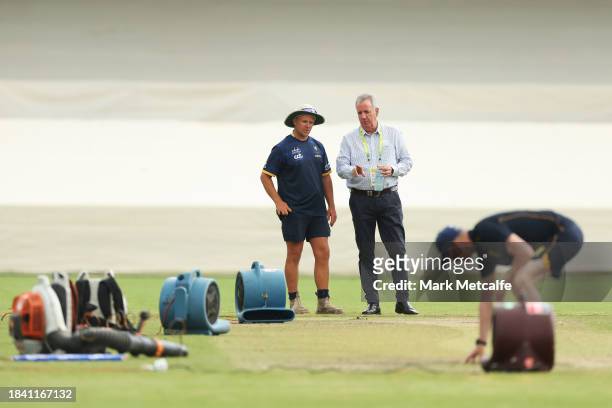Ground staff talk to match offiicials during a delay to the start of play due to an overnight storm during day four of the Tour match between PMs XI...