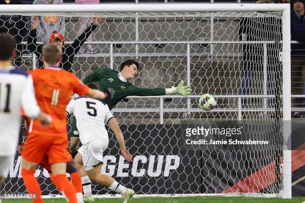 Bryan Dowd of the Notre Dame Fighting Irish reaches for the ball during the Division I Men's Soccer Championship held at the Lynn Family Stadium on...