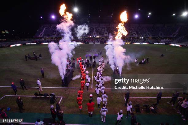 The Notre Dame Fighting Irish and the Clemson Tigers walk out on the field before the Division I Men's Soccer Championship held at the Lynn Family...