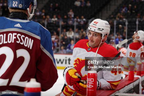 Fredrik Olofsson of the Colorado Avalanche talks with Dennis Gilbert of the Calgary Flames prior to the game at Ball Arena on December 11, 2023 in...