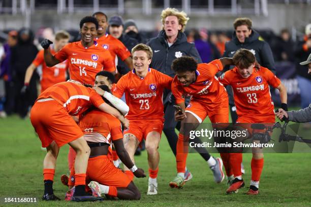 Clemson Tigers celebrate after defeating the Notre Dame Fighting Irish in the Division I Men's Soccer Championship held at the Lynn Family Stadium on...