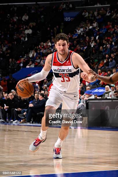 Mike Muscala of the Washington Wizards drives to the basket during the game against the Philadelphia 76ers on December 11, 2023 at the Wells Fargo...