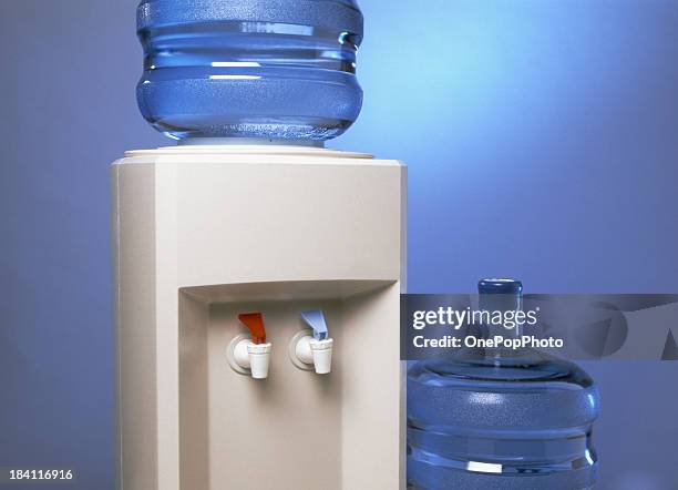 water cooler and large bottles - drinkwaterfontein stockfoto's en -beelden