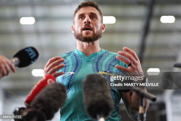 Hurricanes' scrum-half TJ Perenara speaks to media during a training session at the New Zealand Campus of Innovation and Sport in Upper Hutt on...