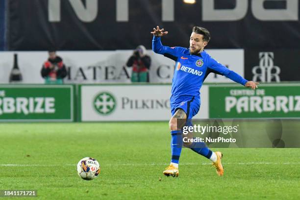 Alexandru Baluta is in action during the match between CFR Cluj and FCSB at Dr. Constantin Radulescu Stadium in Cluj-Napoca, Romania, on December 10,...