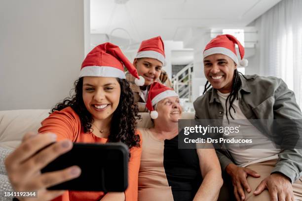 family making video call at christmas - christmas zoom stock pictures, royalty-free photos & images