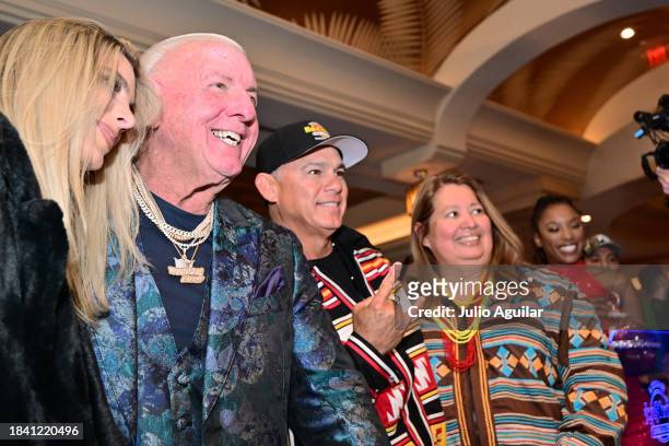Lele Pons, Ric Flair, Chris Osceola, and Holly Tiger pose for a picture at a New Era In Florida Gaming Event at Seminole Hard Rock Hotel & Casino...
